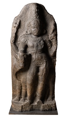 Lot 84 - A CHOLA GRANITE FIGURE OF ARDHANISVARA