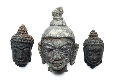 Lot 184 - THREE SMALL BRONZE HEADS OF BUDDHA