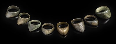 Lot 141 - TWELVE INDO-PERSIAN COPPER ALLOY ARCHER'S RINGS, 16TH/18TH CENTURY