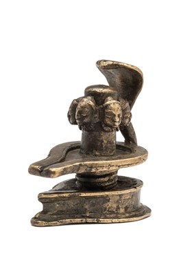 Lot 223 - A SMALL BRONZE FIVE-FACED YONI LINGAM (PANCHAMUKHALINGA)