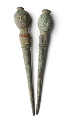 Lot 253 - TWO BRONZE HAIRPINS