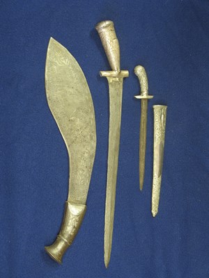 Lot 12 - TWO SOUTH EAST ASIAN DAGGERS AND A NEPALESE KUKRI