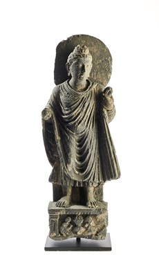 Lot 198 - A GANDHARA GREY SCHIST FIGURE OF BUDDHA, NORTH-WESTERN PAKISTAN, 3RD/4TH CENTURY