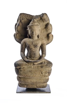 Lot 375 - A KHMER GREY SANDSTONE FIGURE OF BUDDHA SHELTERED BY MUCALINDA, CAMBODIA, 12TH/13TH CENTURY