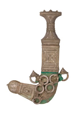 Lot 131 - AN ARAB SILVER-MOUNTED DAGGER (JAMBIYA)