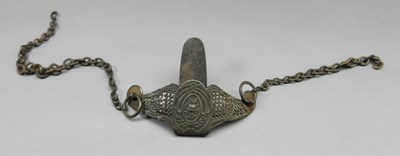 Lot 302 - â€¡A CHISELLED IRON SWORD BELT HOOK AND BRASS CARRYING CHAIN