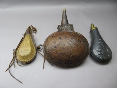 Lot 316 - A NORTH AFRICAN POWDER-FLASK AND TWO FURTHER FLASKS