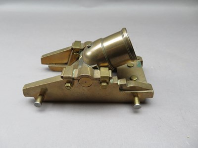 Lot 323 - A BRASS MODEL OF A COHORN MORTAR