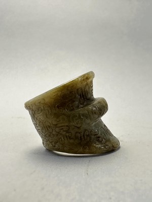 Lot 82 - FOUR CARVED JADE ARCHERS RINGS, QING DYNASTY, 19TH CENTURY