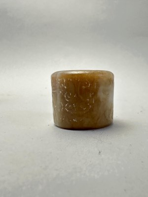 Lot 82 - FOUR CARVED JADE ARCHERS RINGS, QING DYNASTY, 19TH CENTURY