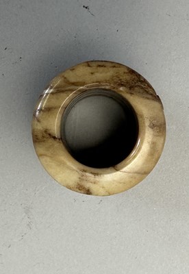 Lot 82 - FOUR CARVED JADE ARCHERS RINGS, QING DYNASTY, 19TH CENTURY