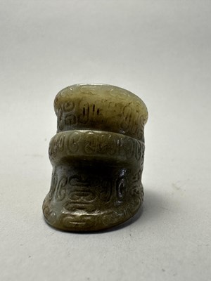 Lot 82 - FOUR CARVED JADE ARCHERS RINGS, QING DYNASTY, 19TH CENTURY