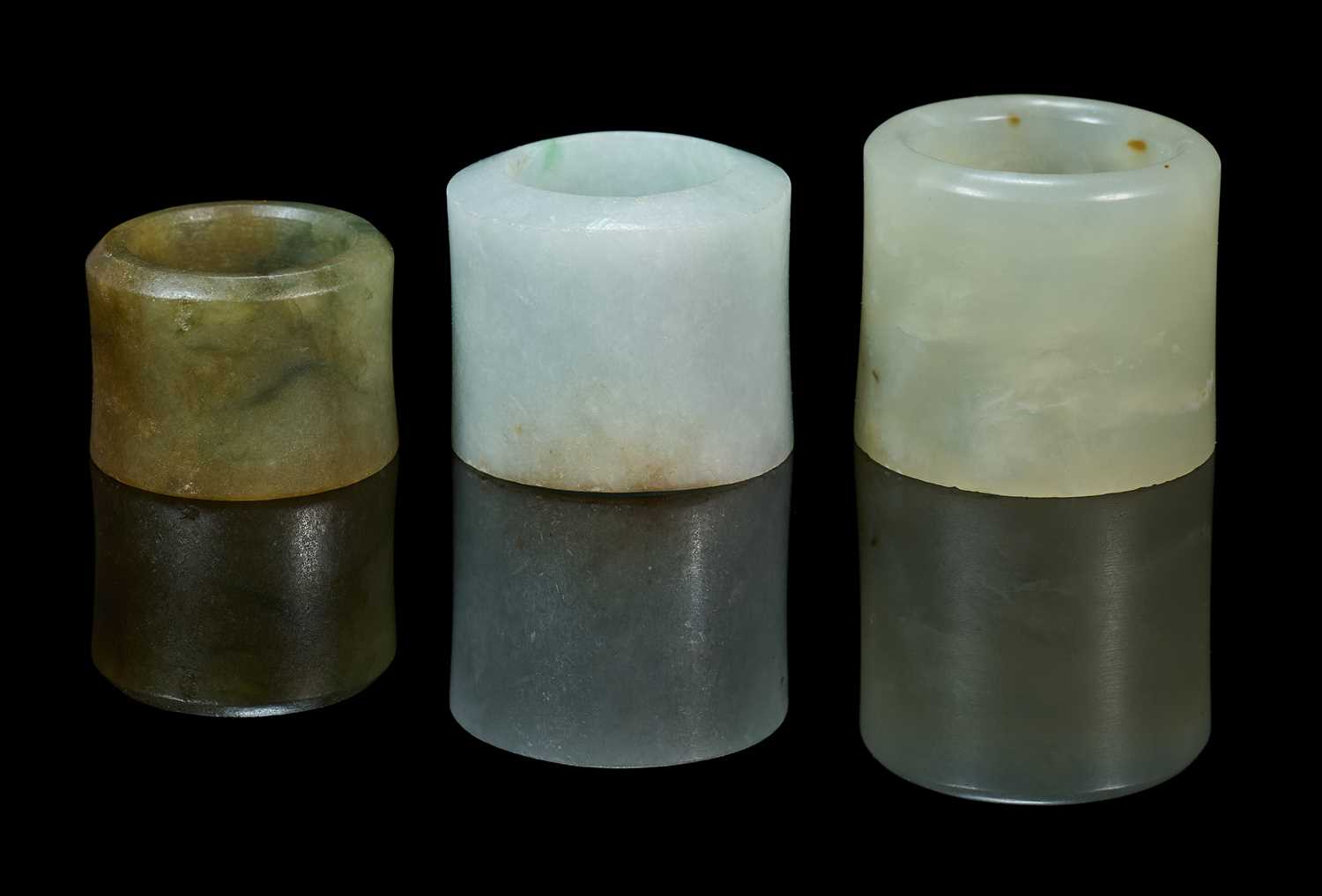 Lot 76 - A GROUP OF SEVEN CHINESE JADE ARCHERS RINGS, QING DYNASTY, 19TH CENTURY