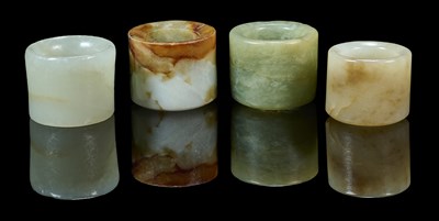 Lot 76 - A GROUP OF SEVEN CHINESE JADE ARCHERS RINGS, QING DYNASTY, 19TH CENTURY