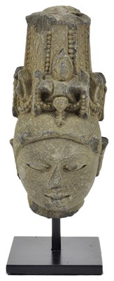 Lot 135 - A GREY STONE HEAD OF A DEITY