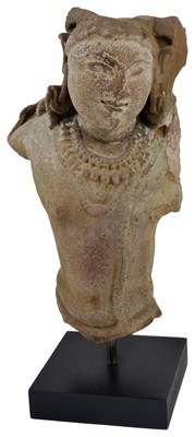 Lot 141 - A PINK SANDSTONE BUST OF A MALE DEITY, PROBABLY VISHNU