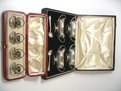 Lot 406 - A CASED SET OF FOUR VICTORIAN SILVER SALT CELLARS AND SPOONS