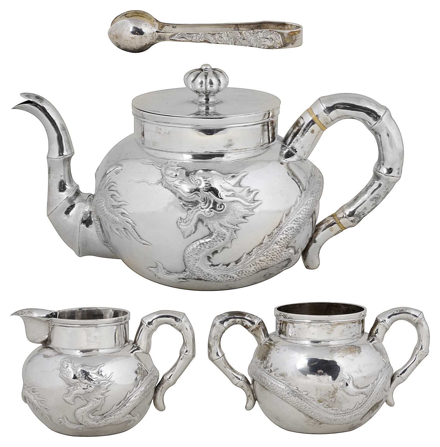 Lot 34 - ËœA BOXED CHINESE SILVER THREE-PIECE TEA SET AND SUGAR TONGS