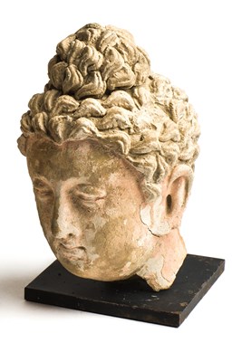 Lot 91 - A GANDHARA STUCCO HEAD OF BUDDHA, 4TH / 5TH CENTURY