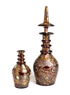 Lot 145 - TWO BOHEMIAN RED OVERLAY GLASS DECANTERS, CIRCA 1900