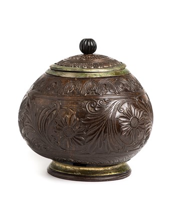 Lot 167 - A CARVED COCONUT JAR, SRI LANKA, LATE 19TH CENTURY