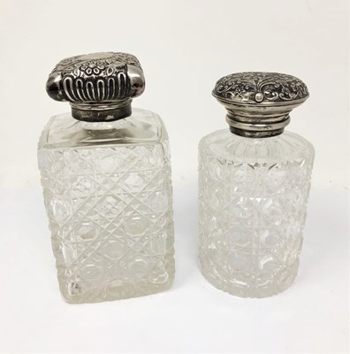 Lot 274 - ËœTWO VICTORIAN SILVER-MOUNTED CUT-GLASS TOILET BOTTLES