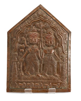 Lot 84 - A COPPER REPOUSSE PLAQUE DEPICTING TWIN DEITIES