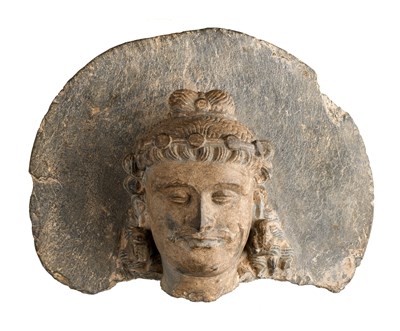 Lot 118 - A GANDHARA GREY SCHIST HEAD OF THE BODHISATTVA MAITREYA