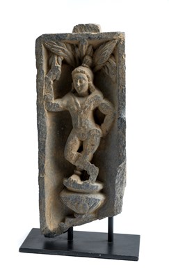 Lot 121 - A GANDHARA GREY SCHIST RELIEF DEPICTING A YAKSHA