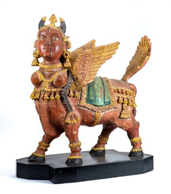 Lot 161 - A CARVED AND PAINTED WOOD FIGURE OF KAMADENU