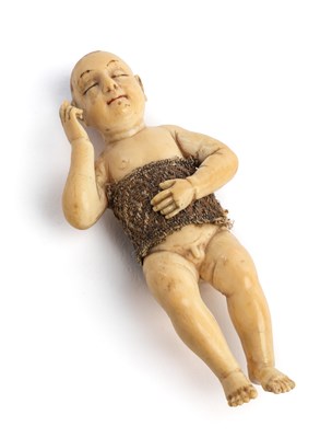 Lot 267 - A SMALL HISPANO-PHILIPPINE IVORY FIGURE OF THE SLEEPING CHRIST CHILD (SANTO NINO DORMIDO)