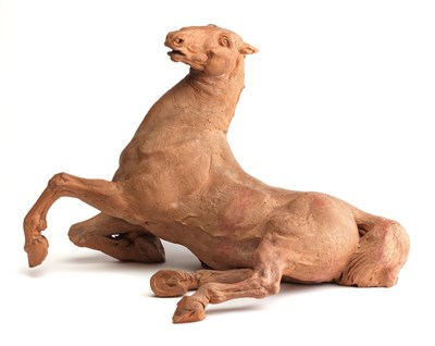 Lot 271 - A TERRACOTTA FIGURE OF A RECUMBENT HORSE