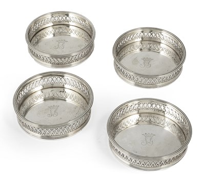 Lot 289 - â“Œ A SET OF FOUR SPANISH SILVER WINE COASTERS