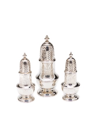 Lot 353 - A SET OF THREE GEORGE II SILVER CASTERS