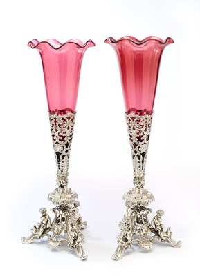 Lot 125 - A PAIR OF VICTORIAN ELECTROPLATE VASE STANDS WITH CRANBERRY GLASS LINERS, PROBABLY PRYOR, TYZACK & CO., SHEFFIELD, CIRCA 1860