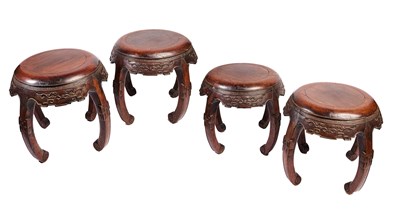 Lot 95 - A RARE SET OF FOUR CHINESE HUALI DRUM STOOLS, QING DYNASTY,  LATE 18TH/EARLY 19TH CENTURY