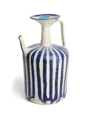 Lot 89 - A KASHAN BLUE AND WHITE EWER, PERSIA, CIRCA 13TH CENTURY