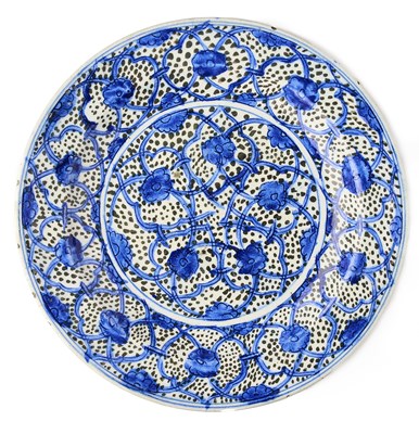 Lot 61 - A SAFAVID BLUE AND WHITE DISH, PERSIA, CIRCA 1700