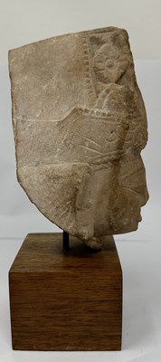 Lot 193 - A BUFF SANDSTONE HEAD OF A DEITY, CENTRAL INDIA, CIRCA 11TH CENTURY