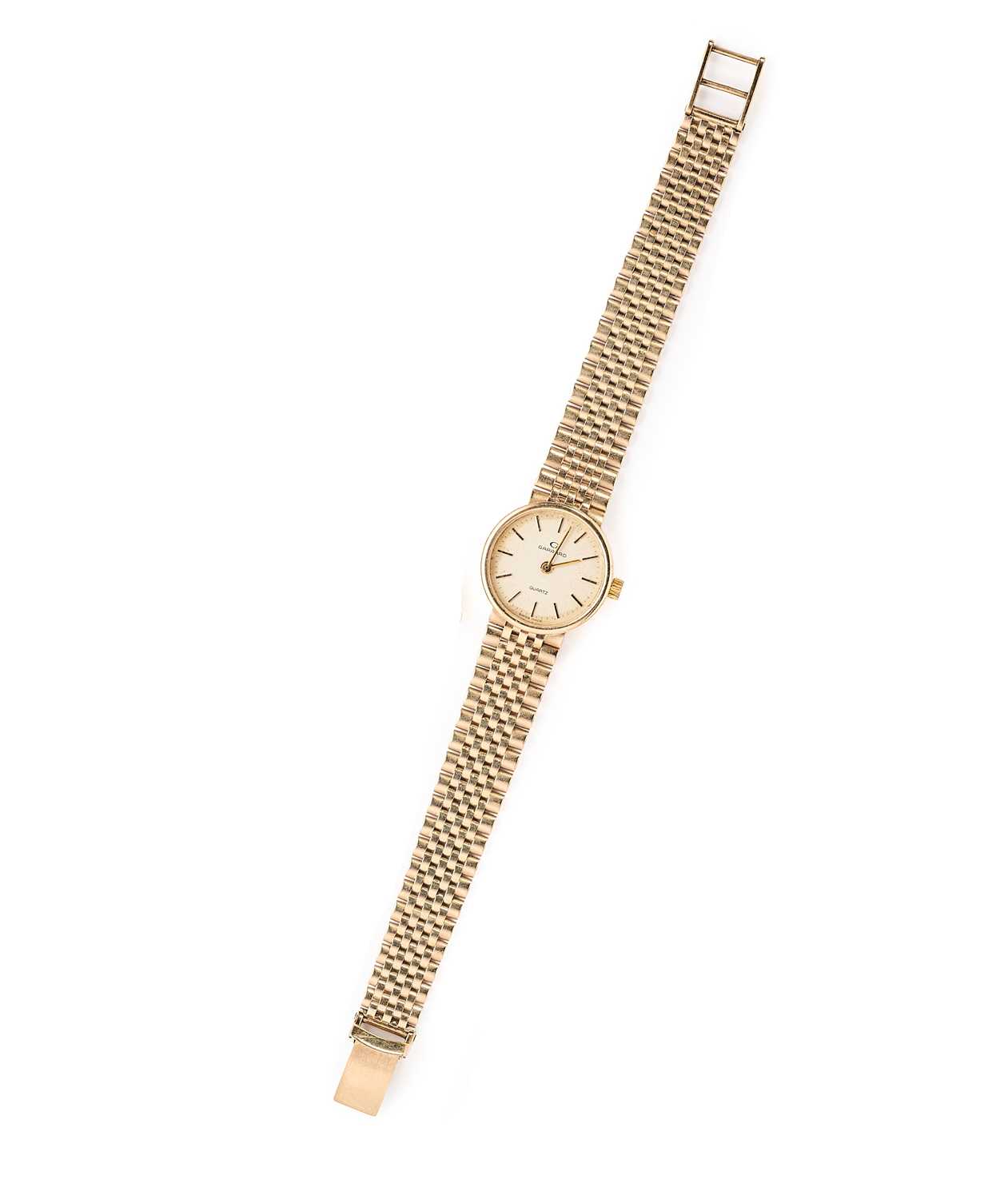 Lot 166 - GARRARD: A LADY'S GOLD BRACELET WATCH, CIRCA 1988