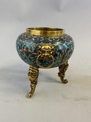 Lot 28 - A CHINESE GILT-BRONZE AND CLOISONNE ENAMEL TRIPOD CENSER AND COVER, QING DYNASTY, QIANLONG PERIOD (1736-95)