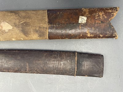 Lot 26 - A DETACHED BLADE FROM A MALAYSIAN DAGGER (KRIS), AN INDIAN SILVER CHAPE FROM A SCABBARD, A KATAR SCABBARD AND SEVEN ASIAN SWORD SCABBARDS, 19TH/EARLY 20TH CENTURIES