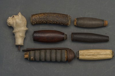 Lot 129 - SIX SWORD GRIPS, 18TH AND 19TH CENTURIES