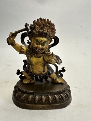 Lot 191 - A SINO-TIBETAN PARCEL GILT BRONZE FIGURE OF MAHAKALA, CHINA, 19TH CENTURY