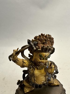 Lot 191 - A SINO-TIBETAN PARCEL GILT BRONZE FIGURE OF MAHAKALA, CHINA, 19TH CENTURY