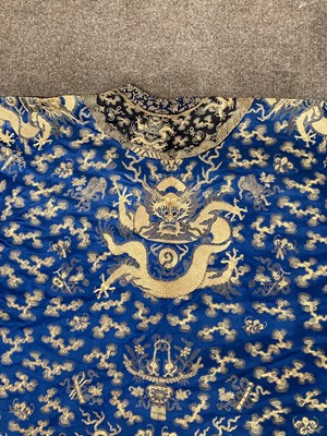 Lot 70 - A CHINESE EMBROIDERED SILK ‘NINE DRAGON’ ROBE, JIFU, LATE QING DYNASTY, CIRCA 1900