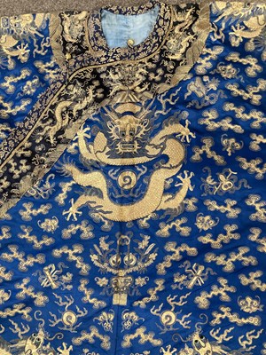 Lot 70 - A CHINESE EMBROIDERED SILK ‘NINE DRAGON’ ROBE, JIFU, LATE QING DYNASTY, CIRCA 1900