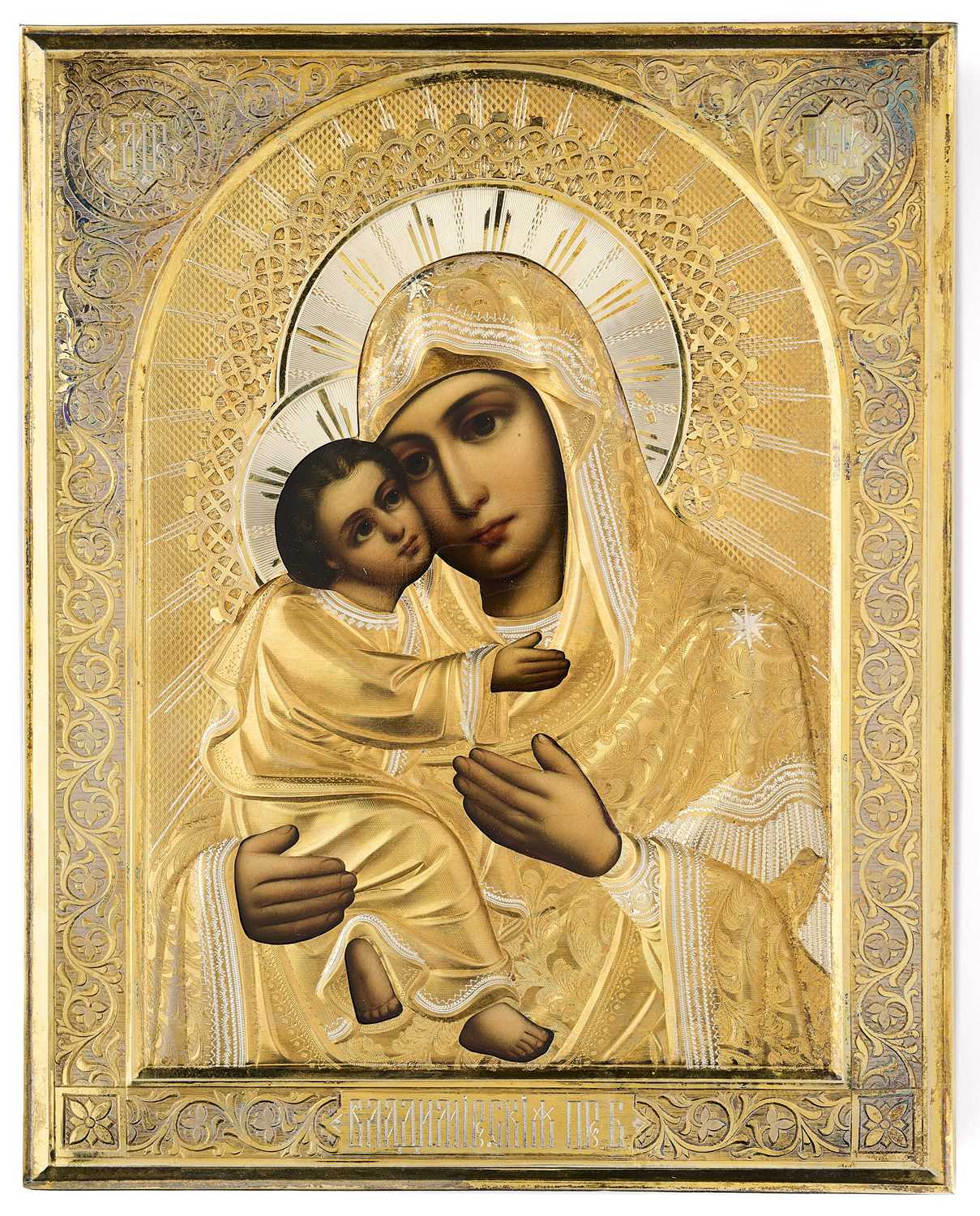 Lot 34 - A RUSSIAN ICON OF THE VLADIMIR MOTHER OF GOD WITH PARCEL-GILT-SILVER OKLAD, MAKER'S MARK GS, MOSCOW, 1908-17