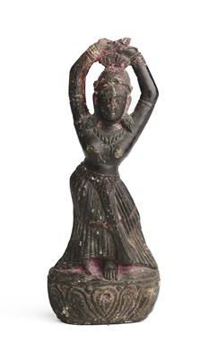 Lot 185 - A NEPALESE CARVED STEATITE FIGURE OF A WOMAN TYING HER HAIR, 19TH CENTURY