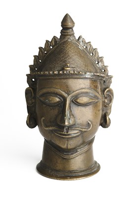 Lot 244 - A BRASS SIVA MASK, WESTERN DECCAN, INDIA, 18TH/19TH CENTURY